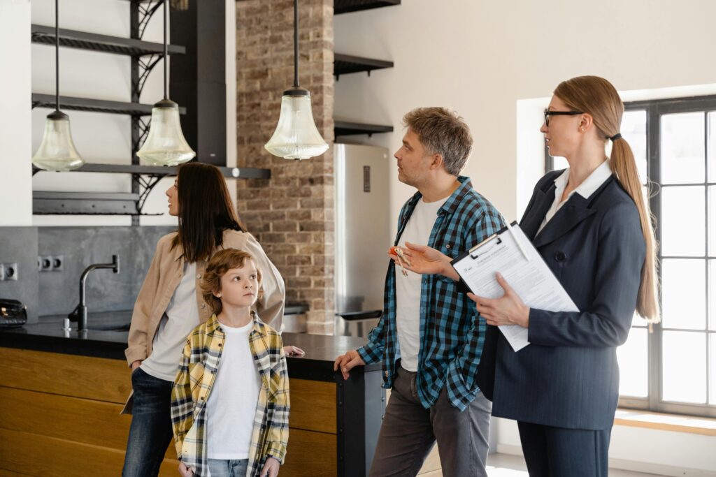 property manager shows a family around a home they might rent