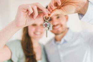 happy couple with house keys