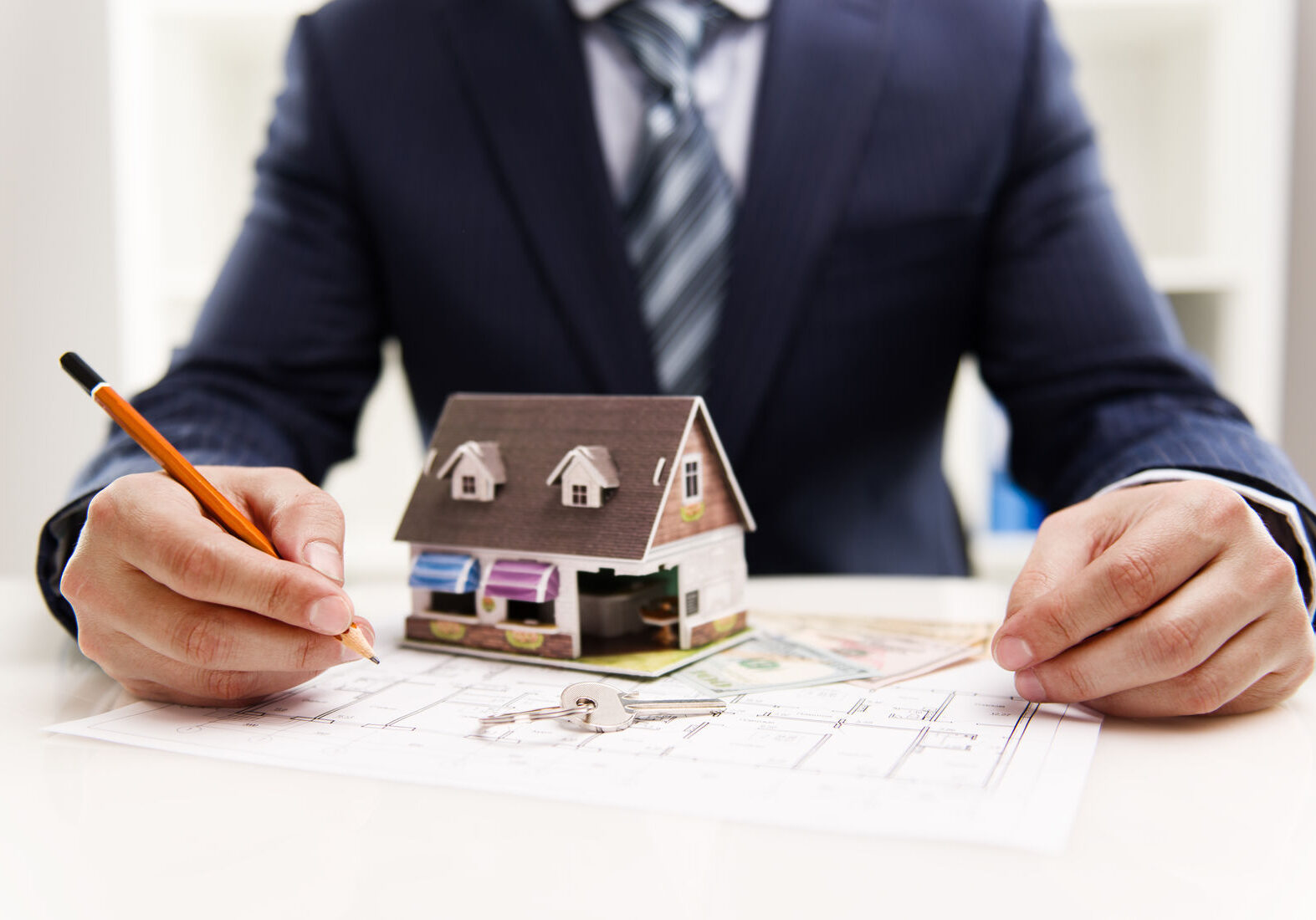 man with house and drawing