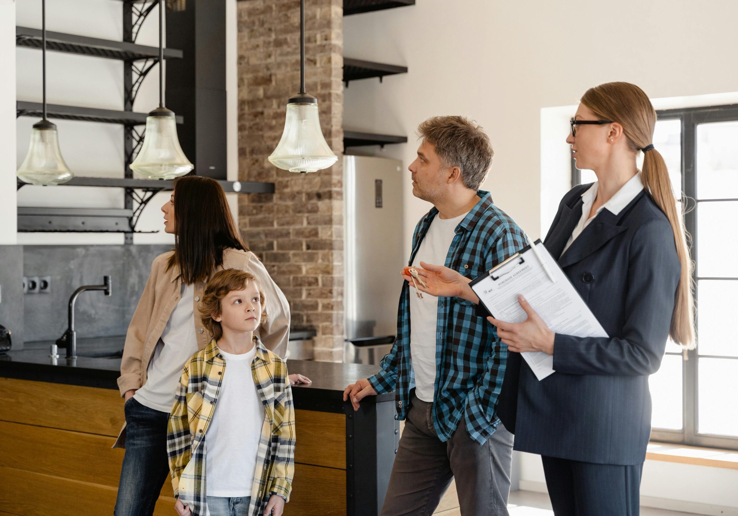 property manager shows a family around a home they might rent