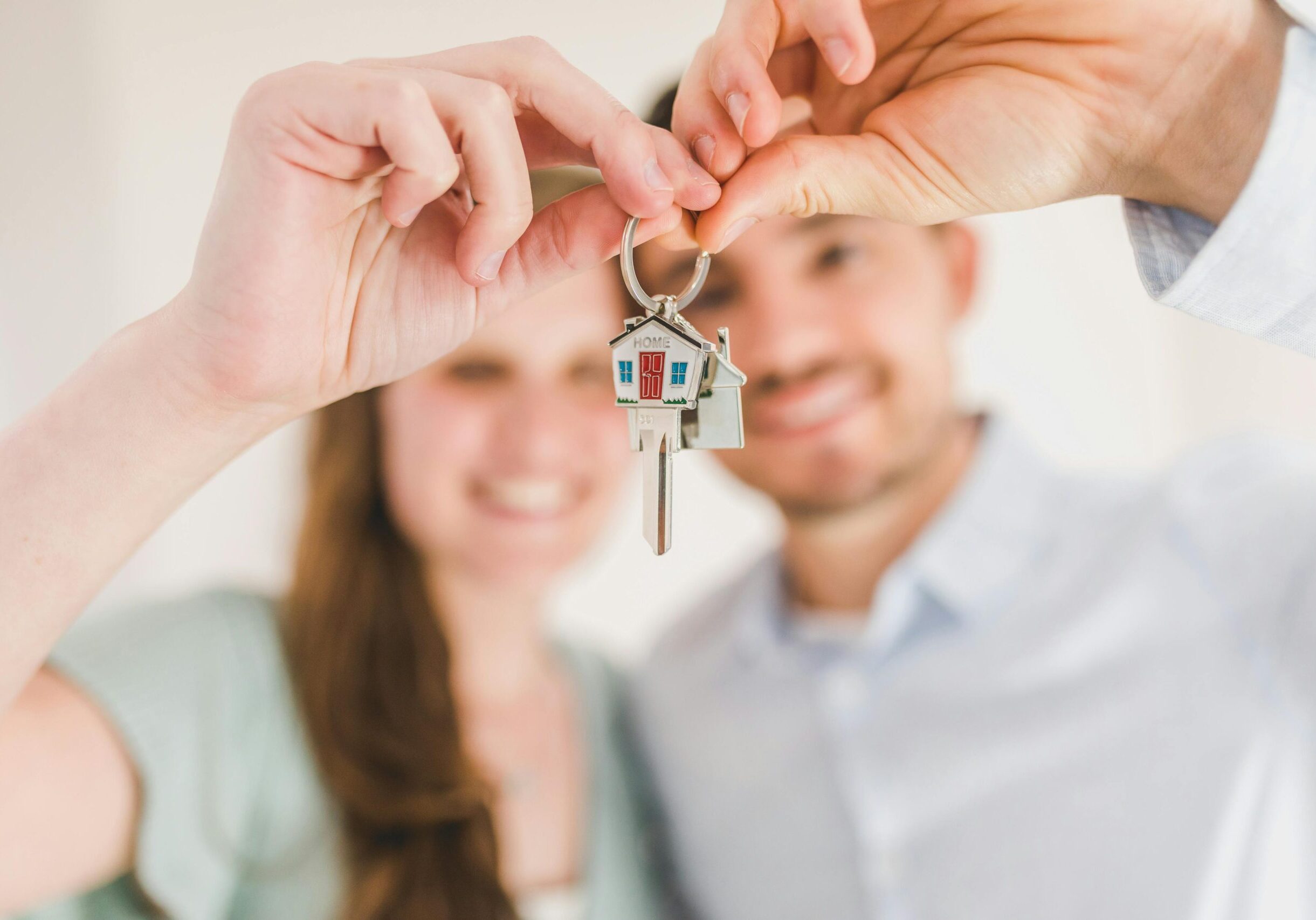 happy couple with house keys